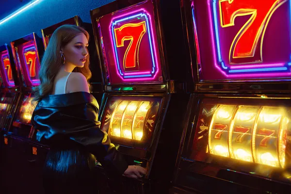 ZEUS75 Jackpot Slots — Spin for massive rewards A dramatic shot of winning sevens landing on a slot reel surrounded by shining gold coins, symbolizing big wins.