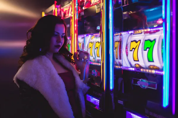 ZEUS75 Mobile Casino — Play anytime, anywhere A player using their smartphone during a festive local event, representing ZEUS75’s fully mobile-friendly casino.
